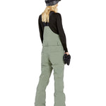 Volcom Women's Swift Bib Overall - Sage green bib overalls with a geometric pattern on the side pocket and black straps.