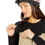 Volcom Women's Swift Bib Overall - Beige bib overalls with black straps and a zipper down the front.