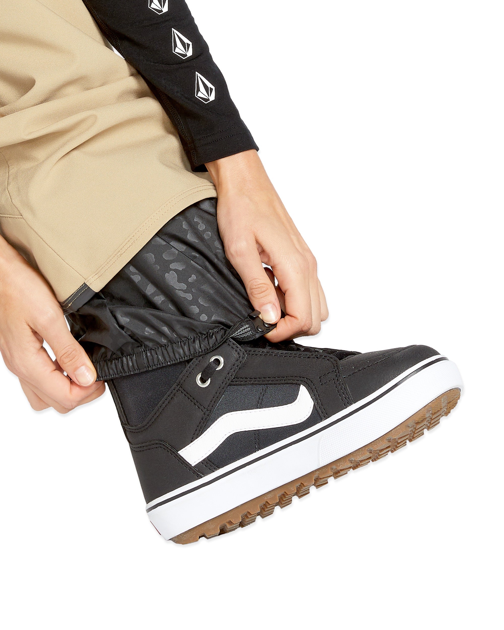 Volcom Women's Swift Bib Overall - A black bib overall with a subtle leopard print pattern on the fabric.