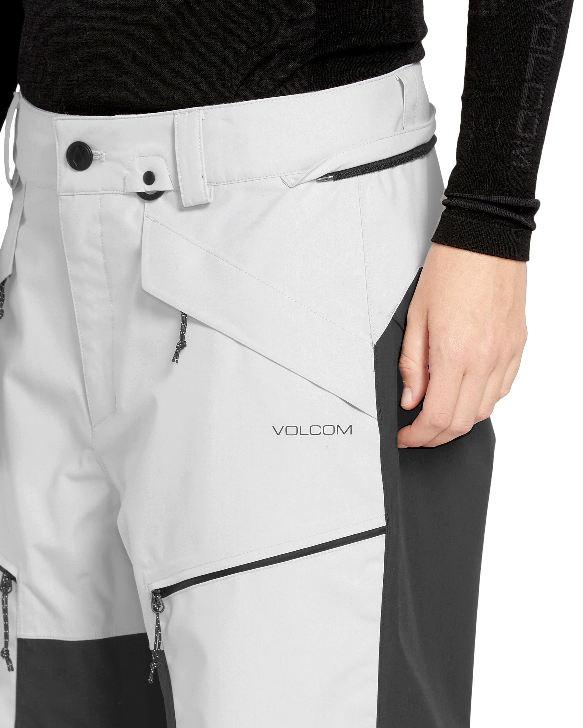 Volcom Women's Stone Mica 20K Pant 2025 - A pair of white ski pants with a black stripe down the side and black zippers.
