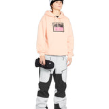 Volcom Women's Stone Mica 20K Pant - A black and white snow pant with a geometric pattern on the leg, featuring a zippered pocket at the thigh.