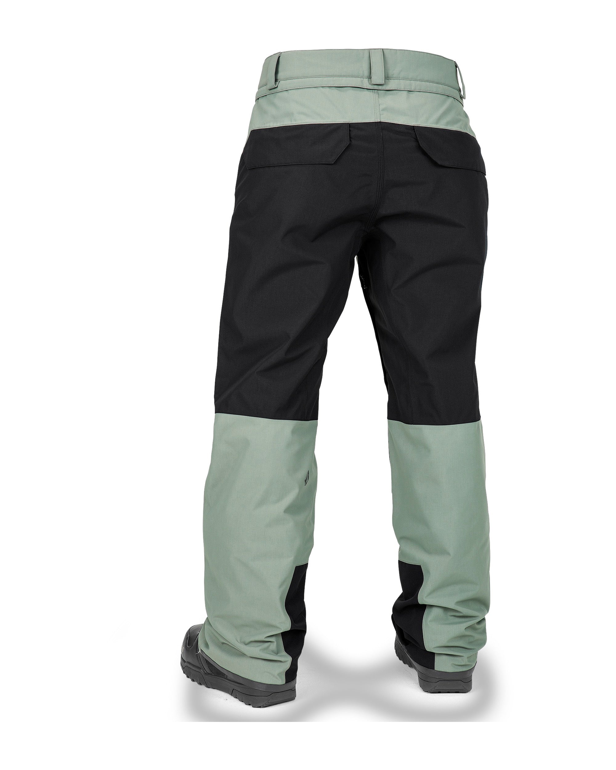 Volcom Women's Stone Mica 20K Pant - Black pants with a subtle green stripe down the side and black zippers on the leg openings.