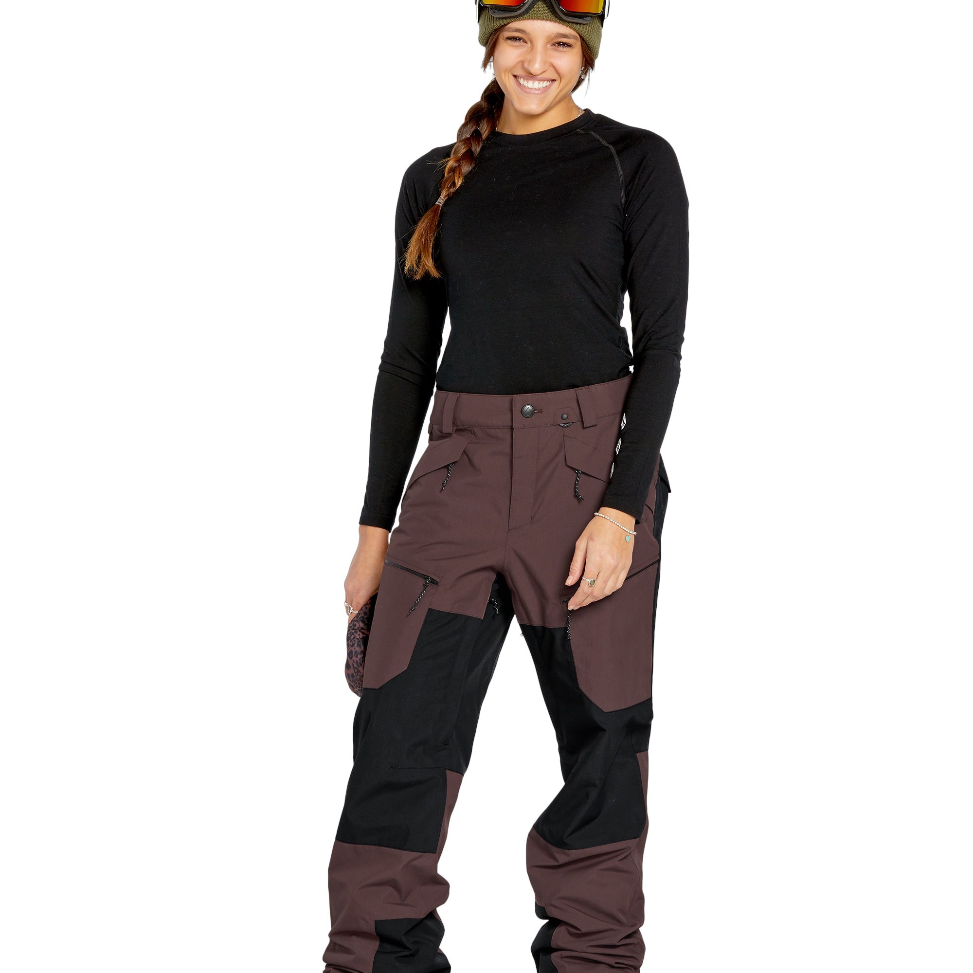 Volcom Women's Stone Mica 20K Pant - A pair of brown snow pants with a black patch on the left thigh and a zippered pocket on the right leg.