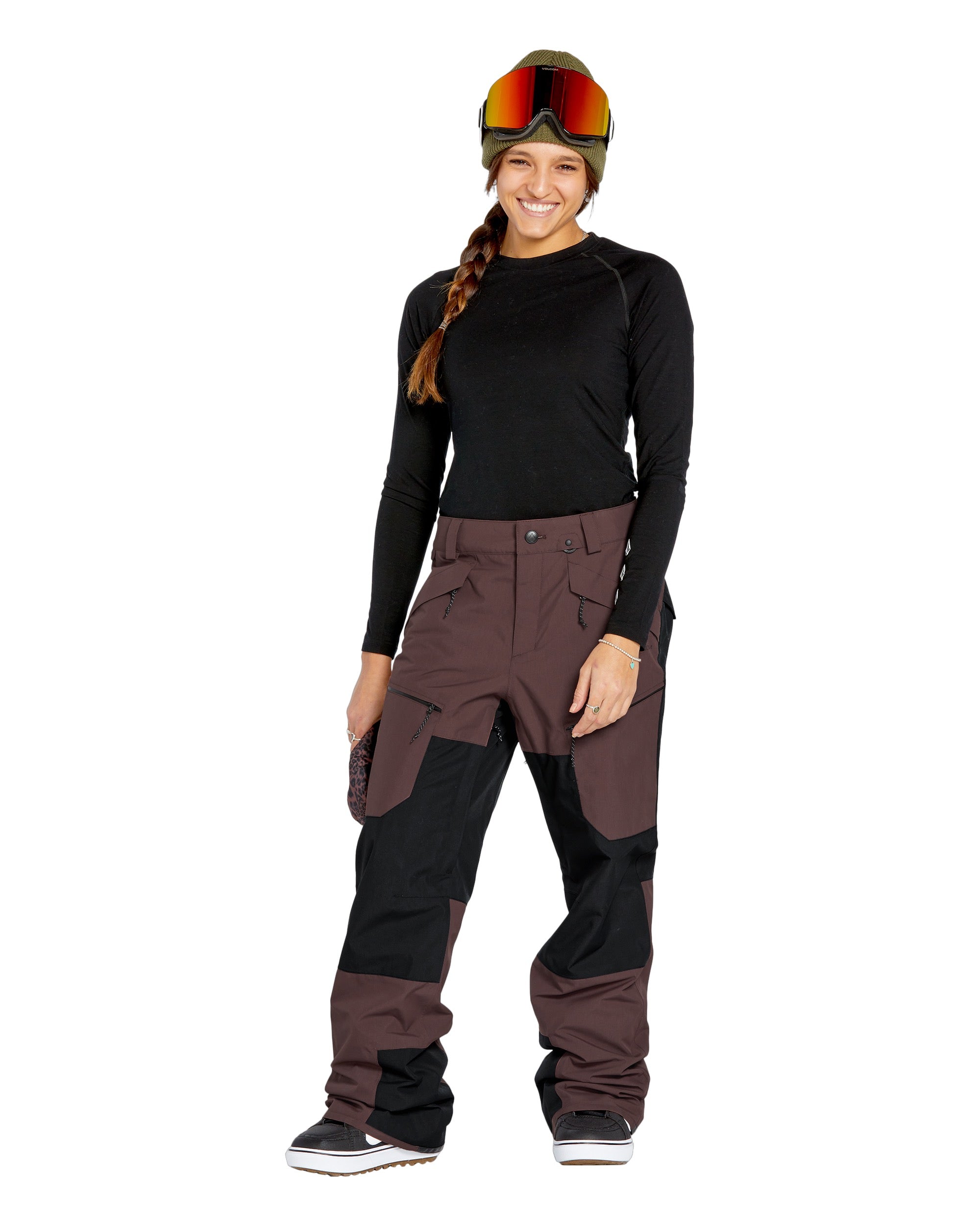 Volcom Women's Stone Mica 20K Pant - A pair of brown snow pants with a black patch on the left thigh and a zippered pocket on the right leg.