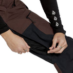 Volcom Women's Stone Mica 20K Pant - A brown and black ski pant with a zippered pocket on the side, featuring a white logo on the left thigh.