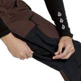 Volcom Women's Stone Mica 20K Pant - A brown and black ski pant with a zippered pocket on the side, featuring a white logo on the left thigh.