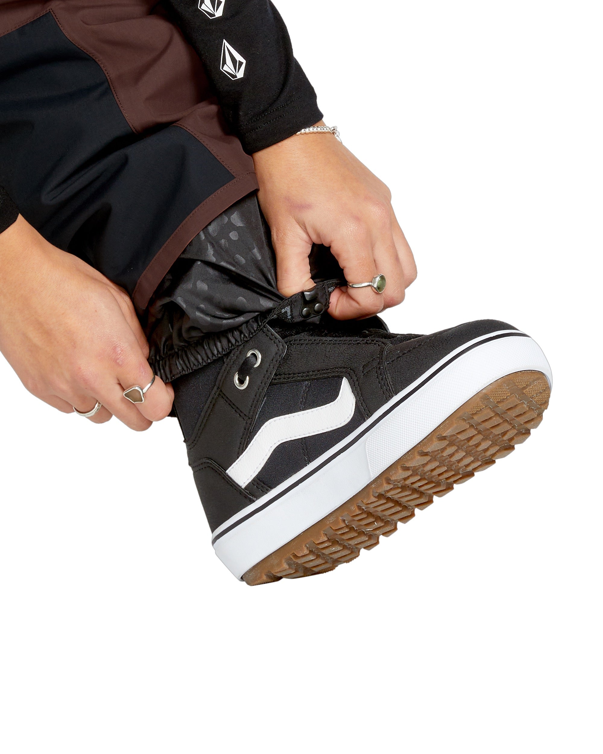 Volcom Women's Stone Mica 20K Pant - A pair of black snow pants with a subtle grey pattern and white accents on the side pockets.