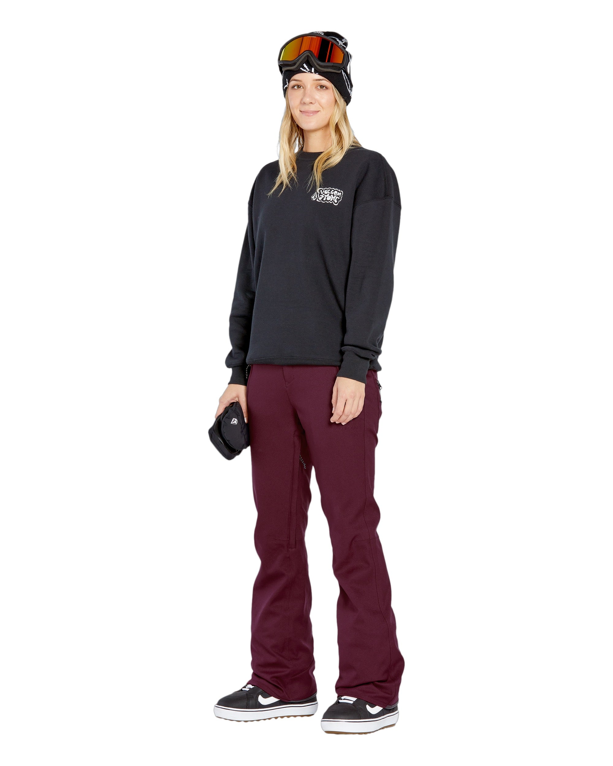 Volcom Women's Genus Stretch Pant 2025 - Black snow pants with a subtle white logo on the left thigh and zippered pockets at the hips.