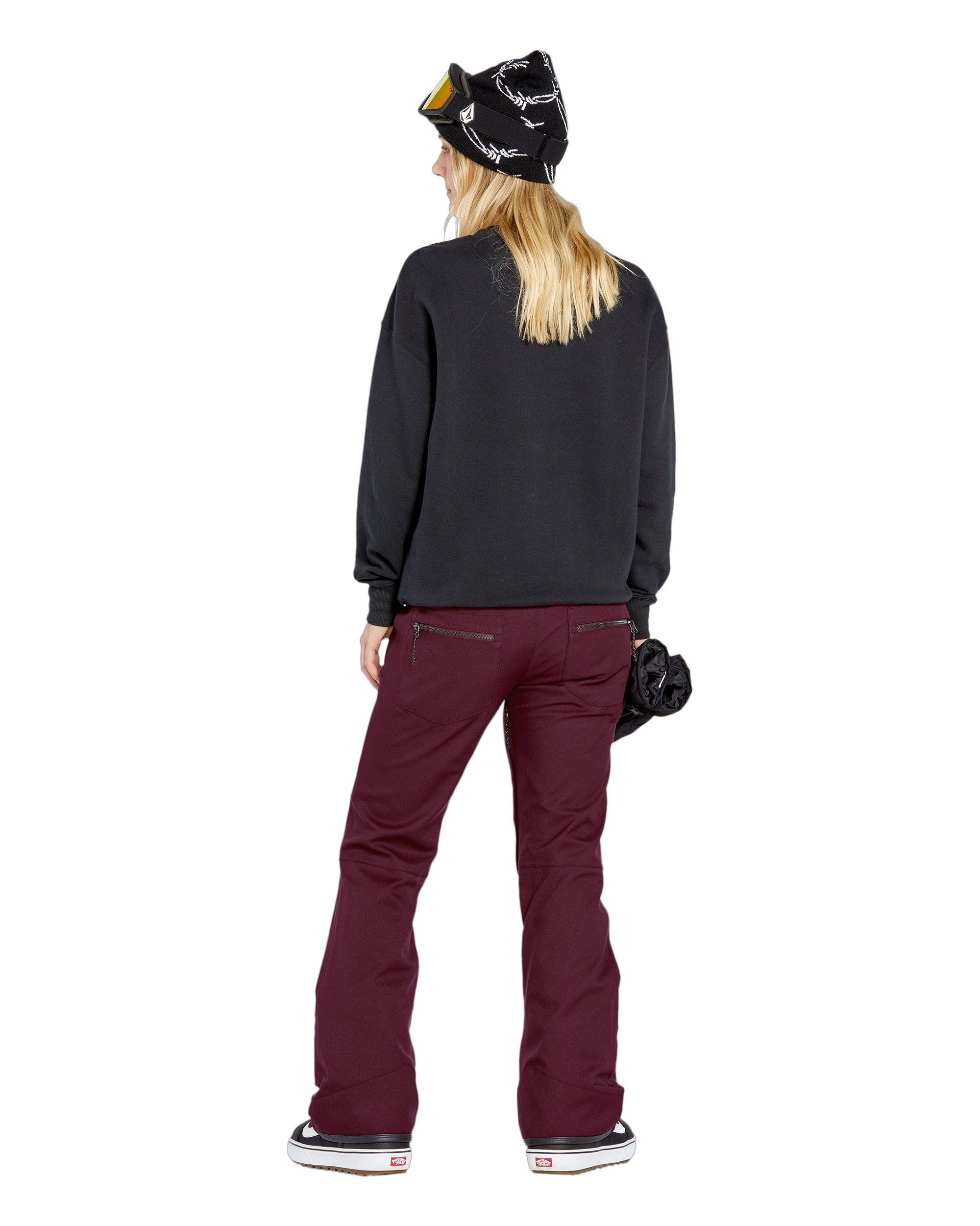 Volcom Women's Genus Stretch Pant 2025 - A black ski pant with a white logo on the left thigh and zippered pockets.