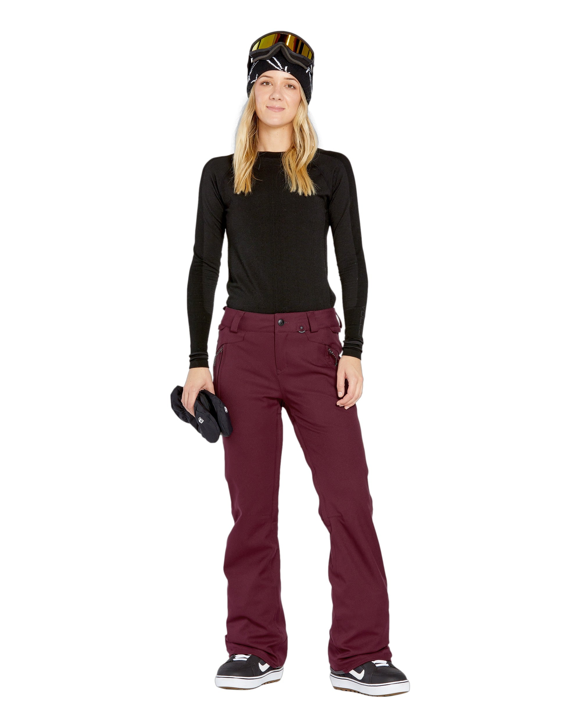 Volcom Women's Genus Stretch Pant 2025 - A pair of maroon snow pants with a zippered pocket on the side and a button fly.
