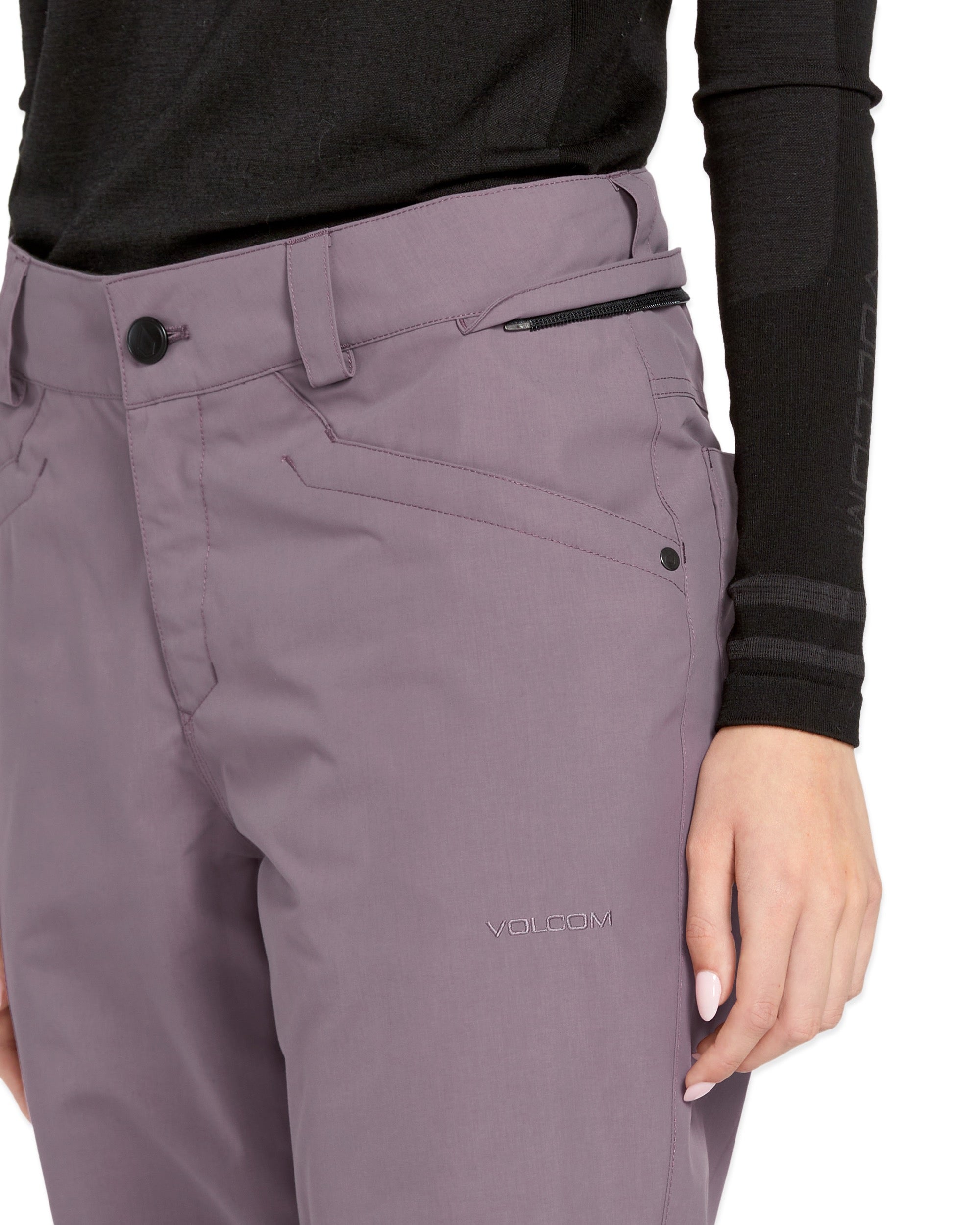 Volcom Women's Hallen Shell Pant 2025 - A pair of light purple snow pants with a zippered pocket on the side and a black zipper pull.