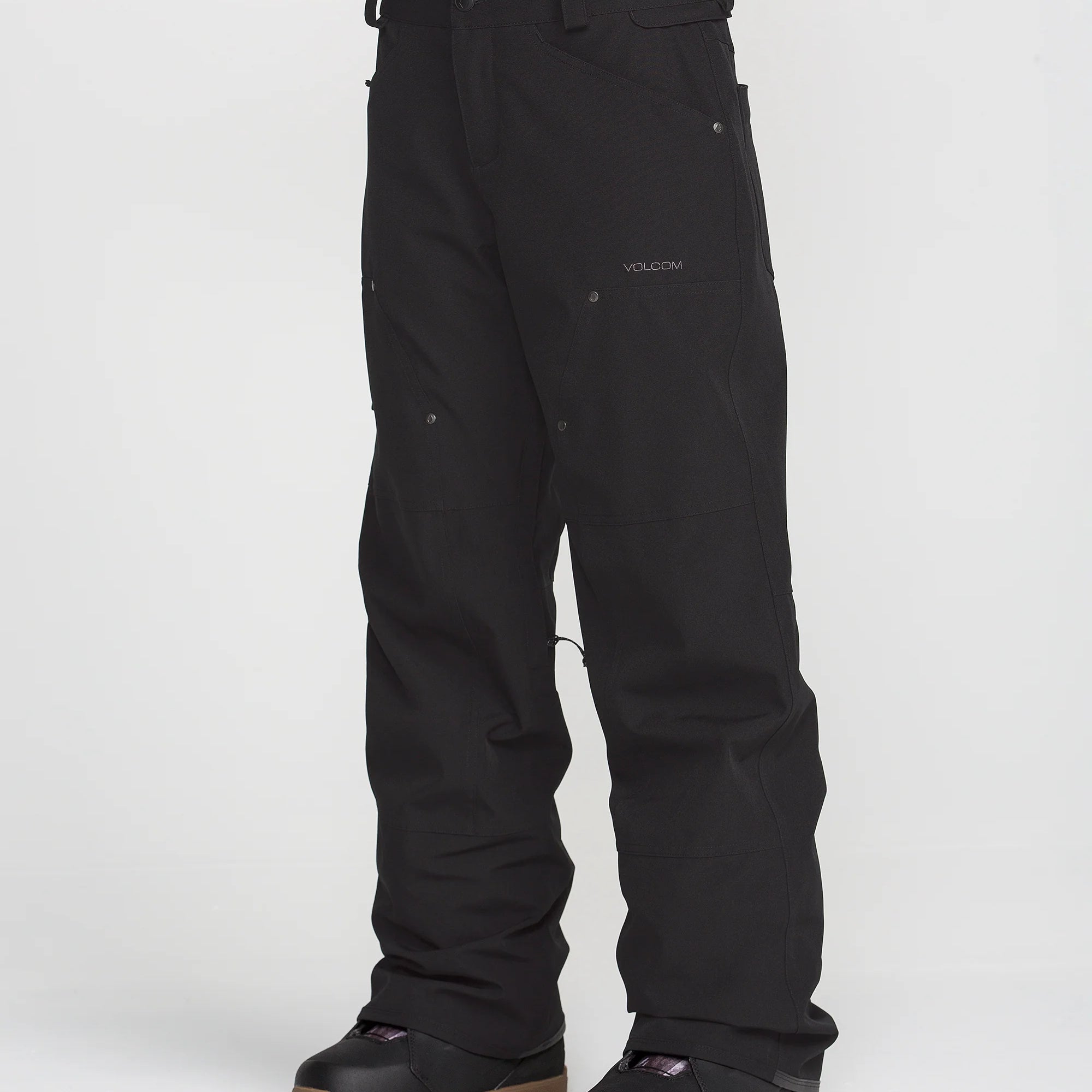 Black Volcom baggy snow pants with small logo on thigh and wide cuff hems.