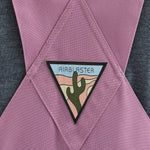 Airblaster Women's Hot Bib Shell 2025 - A pink snow bib shell with a white logo on the left chest and a black zipper running down the front.