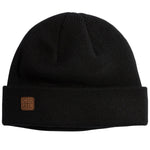 HARBOR KNIT BEANIE 2024 - A black beanie with a brown leather patch on the front.