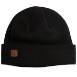 HARBOR KNIT BEANIE 2024 - A black beanie with a brown leather patch on the front.