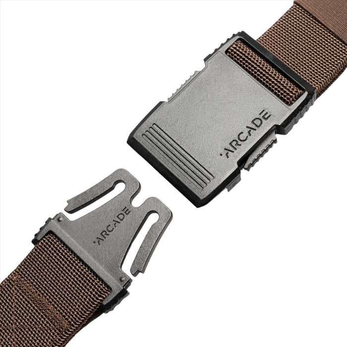 A close-up of the dark brown belt's unfastened buckle. The black plastic buckle parts are separated, showing the hook mechanism on one side and the slot on the other, with "ARCADE" embossed on the hook side.