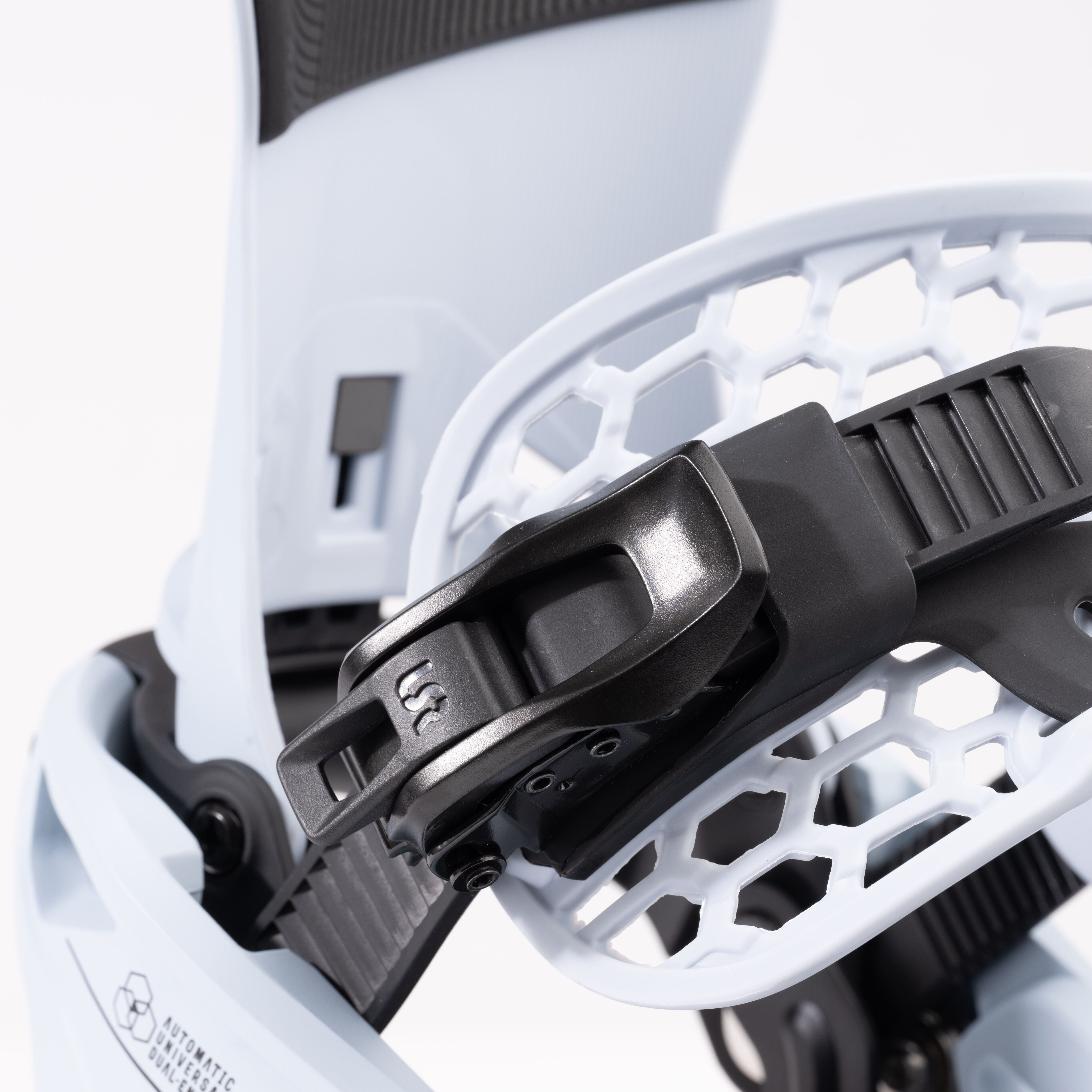 Nidecker Supermatic Snowboard Binding - A black binding with a white logo on the strap, featuring a honeycomb pattern on the baseplate.