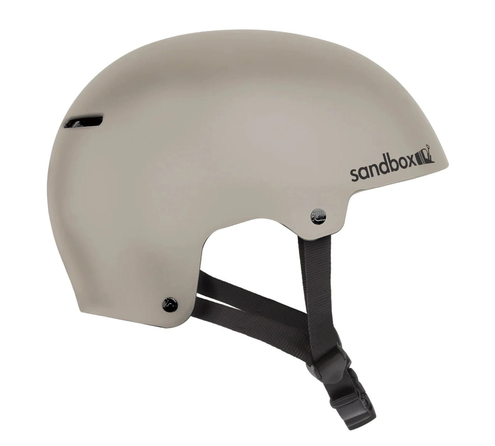 Sandbox Icon Brain Bucket Helmet 2025 - A white helmet with a black strap and buckle on the back, featuring the word "sandbox" in gray letters on the side.