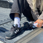 Stance Icon Quarter Sock 2025 - White crew socks with black logo on ankle.