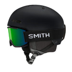 Kids MIPS ski helmet, matte black, side view with green-tinted goggle lens