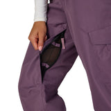 Black plum cargo pants showing side pocket opening and layered panel construction