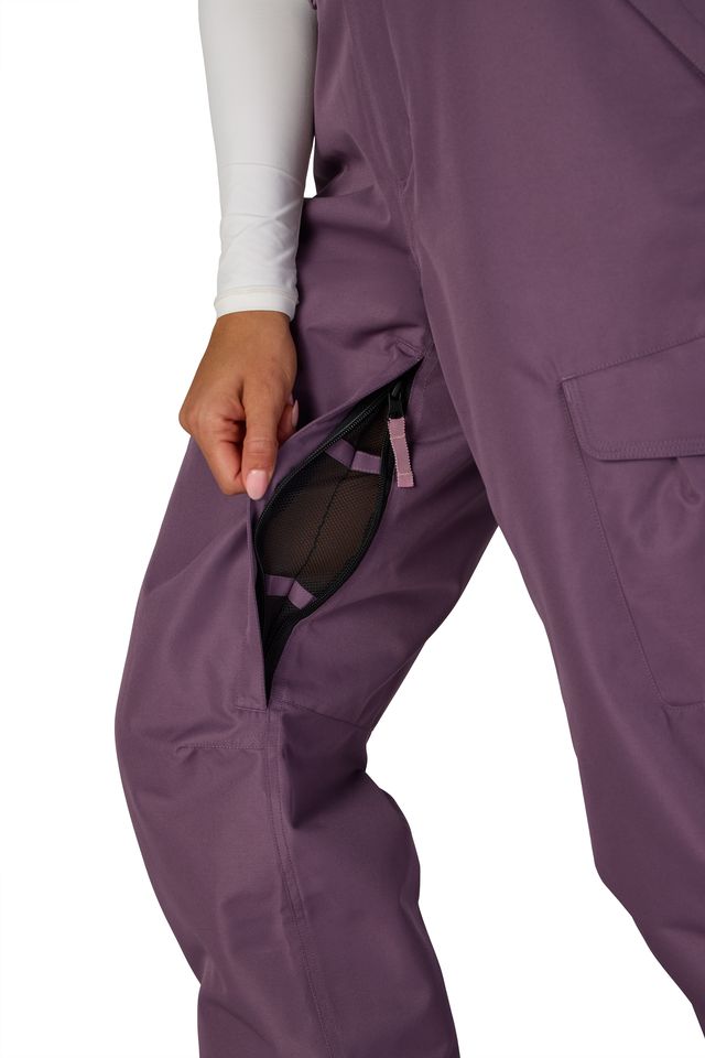 Black plum cargo pants showing side pocket opening and layered panel construction