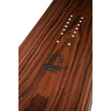 Jones Flagship Snowboard 2022 - A brown snowboard with a black logo of a ship on it.