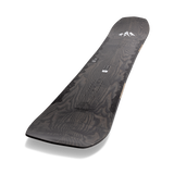 Jones Ultra Flagship Snowboard 2024 - A black snowboard with a wood grain pattern on its top surface, featuring a white logo at the tail end.