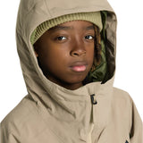 Burton Junior's Hillslope Insulated Jacket 2025 - A tan jacket with a green logo on the left chest and a hood.