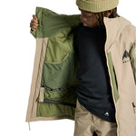 Burton Junior's Hillslope Insulated Jacket 2025 - A green and tan insulated jacket with a zippered front, worn by a model on a plain white background.
