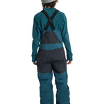Burton Junior's Skylar 2L Bib Pant 2025 - A pair of dark blue snow pants with a black bib and adjustable straps.