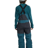 Burton Junior's Skylar 2L Bib Pant 2025 - A pair of dark blue snow pants with a black bib and adjustable straps.