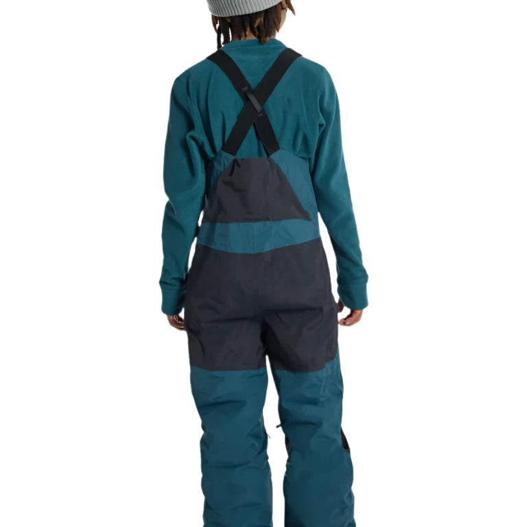 Burton Junior's Skylar 2L Bib Pant 2025 - A pair of dark blue snow pants with a black bib and adjustable straps.