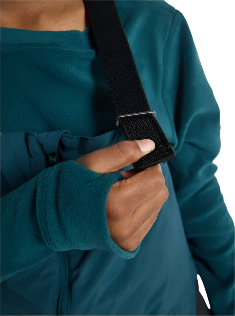 Burton Junior's Skylar 2L Bib Pant 2025 - A pair of dark blue snow pants with a white logo on the left leg and adjustable straps at the waist.