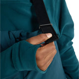 Burton Junior's Skylar 2L Bib Pant 2025 - A pair of dark blue snow pants with a white logo on the left leg and adjustable straps at the waist.