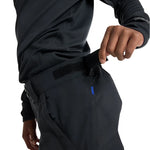 Burton Junior's Skylar 2L Pant 2025 - Black snow pants with a small blue logo on the left leg.