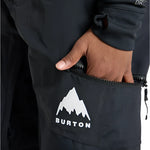 Burton Junior's Skylar 2L Pant 2025 - Black snow pants with a white logo on the left leg featuring a mountain graphic and the word "BURTON" in bold letters.