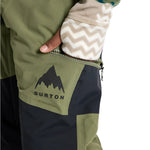 Burton Junior's Skylar 2L Pant 2025 - A pair of olive green snow pants with a black logo on the left leg and a zipper pocket on the right thigh.