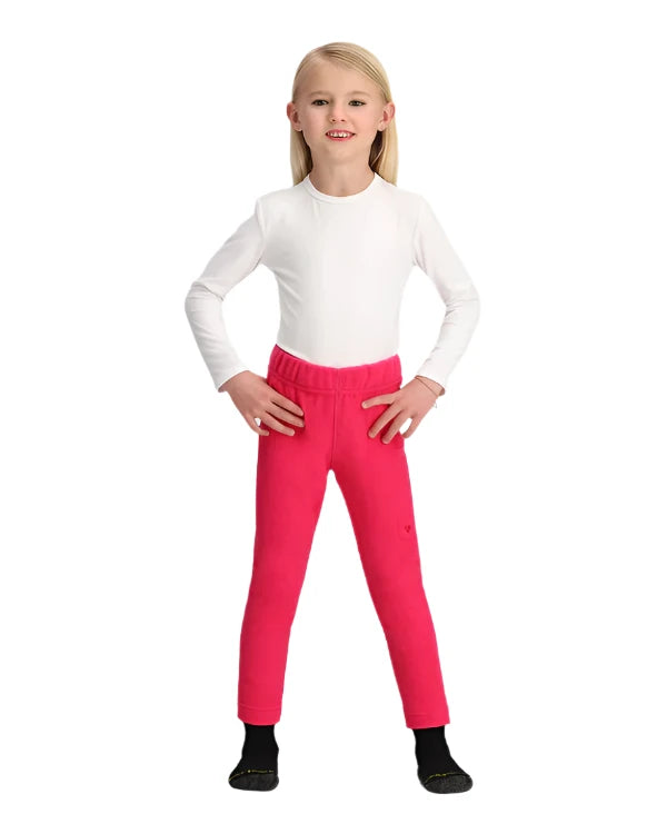Obermeyer Junior's Ultra Gear Pant 2025 - A pair of bright pink ski pants with a subtle snowflake pattern on the left leg, featuring an elastic waistband and two zippered pockets.
