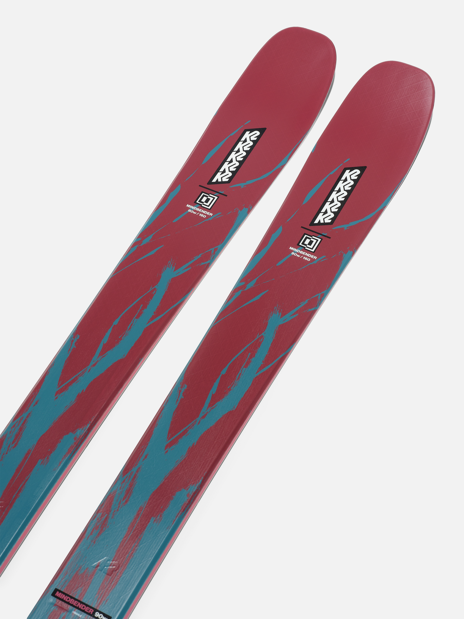 Red and teal graphic ski tops with K2 logo and black bindings