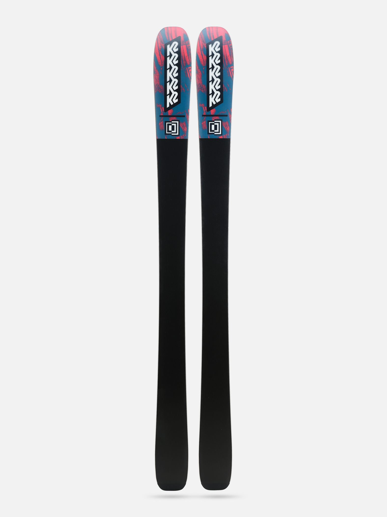 Pair of skis showing black bases with teal and pink tops