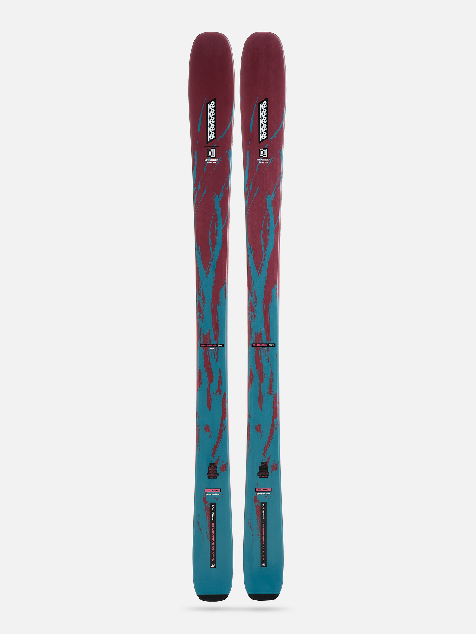 Vertical view of red and teal skis with black bindings and bases