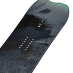 K2 Alchemist snowboard features a dark blue graphic and subtle white branding.