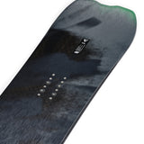 K2 Alchemist snowboard features a dark blue graphic and subtle white branding.