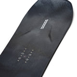 K2 Alchemist snowboard 2025 features a black base with white and blue graphics.