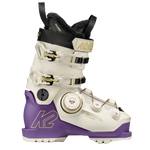White and purple women’s ski boots with black collar, BOA dial, and metal buckles