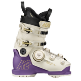 White and purple women’s ski boots with black collar, BOA dial, and metal buckles