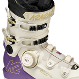 White and purple ski boot with BOA dial, black liner, and adjustable buckles