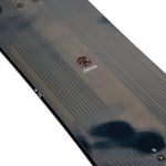 K2 Antidote snowboard 2025 features a dark gray top with distinctive graphics.