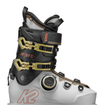White/black BOA ski boots with gold buckles and black ankle strap